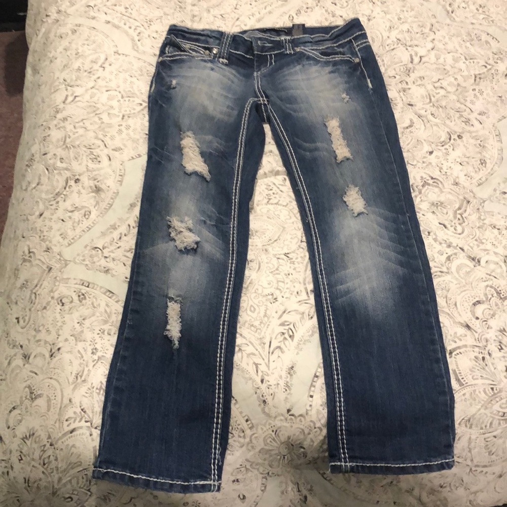 Dark distressed jean capris